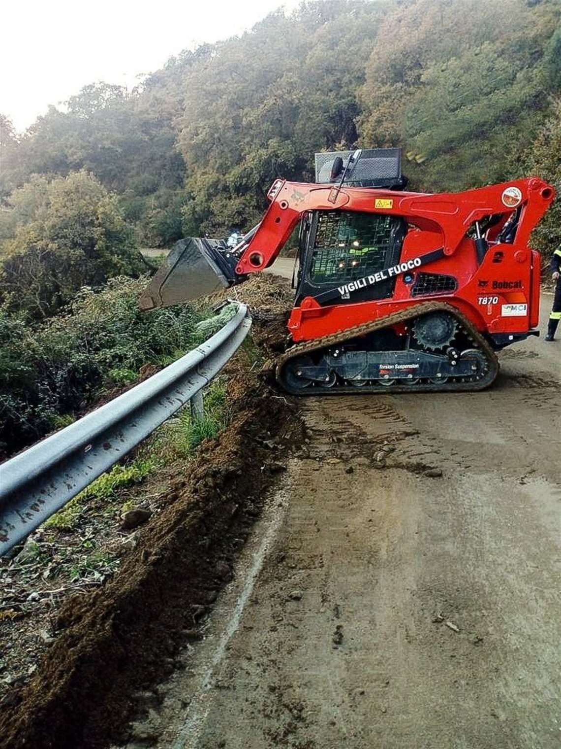 Providing access: The Bobcat T870 clears debris after a mud slide on a mountain road.
