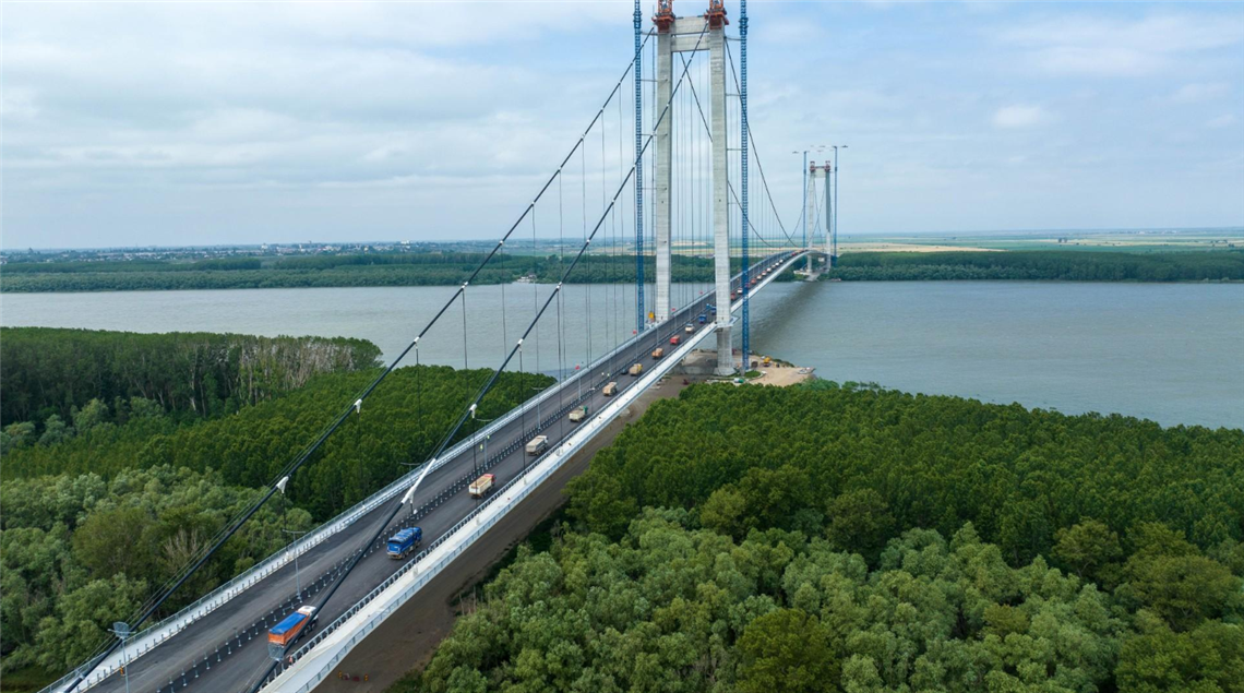 60 trucks weighing a total of 2,400 tonnes test the structural soundness of the Braila Bridge in Romania