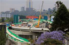 Workers are seen on site during the construction of the Nairobi Expressway, undertaken by the China Road and Bridge Corporation (CRBC) on a public-private partnership (PPP) basis, along Uhuru Highway in Nairobi 