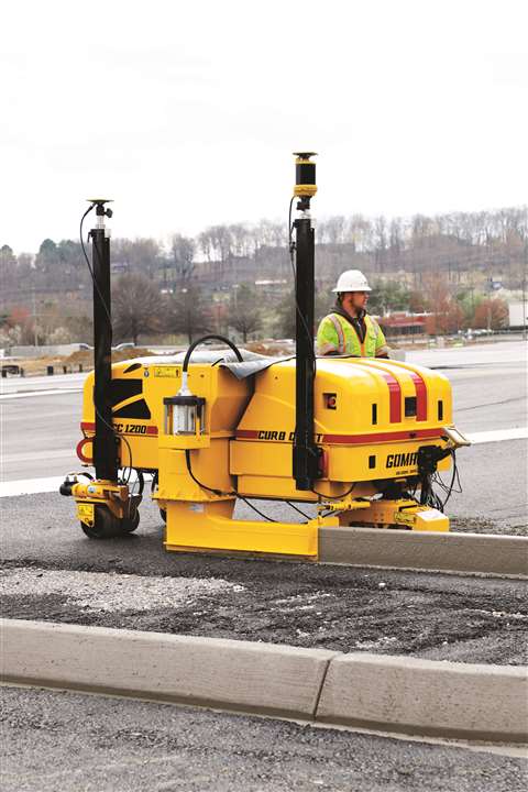 A worker on the CC-1200e electric curb machine