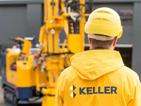 A Keller group worker stands in front of a piling rig (Image courtesy of Keller Group)