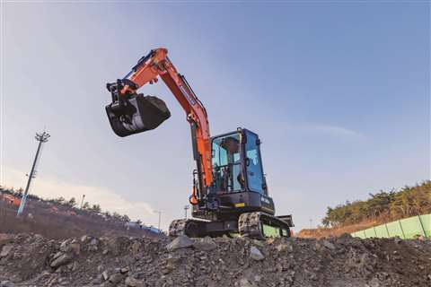 Compact excavator at work